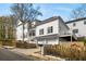 Charming two-story home featuring a two-car garage and private side balcony, surrounded by lush landscaping at 1399 Knob Hill Se Ct, Atlanta, GA 30316
