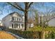 Charming two-story white home with black shutters and a welcoming front porch, set on a well-maintained lot at 1399 Knob Hill Se Ct, Atlanta, GA 30316