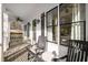 Relaxing front porch with rocking chairs and ceiling fan, offering a cozy outdoor space at 1399 Knob Hill Se Ct, Atlanta, GA 30316