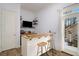 Built-in home bar with live-edge wood countertop and rustic-style stools at 1399 Knob Hill Se Ct, Atlanta, GA 30316