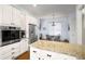 Modern kitchen featuring granite countertops, stainless steel appliances, and a breakfast nook at 1399 Knob Hill Se Ct, Atlanta, GA 30316