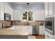 Well-equipped kitchen featuring granite countertops, stainless steel appliances, and plenty of storage at 1399 Knob Hill Se Ct, Atlanta, GA 30316