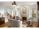 Comfortable living room featuring fireplace, hardwood floors, and an open layout at 1399 Knob Hill Se Ct, Atlanta, GA 30316