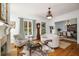Cozy living room with fireplace, hardwood floors, and dining room views at 1399 Knob Hill Se Ct, Atlanta, GA 30316