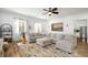 Bright living room featuring an L-shaped sectional and hardwood floors at 1399 Knob Hill Se Ct, Atlanta, GA 30316