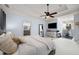 Bright main bedroom with sitting area, a television, and a peek to the main bathroom at 1399 Knob Hill Se Ct, Atlanta, GA 30316