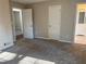 Large bedroom with multiple doors and carpet at 3690 Darrah Sw Way, Atlanta, GA 30331