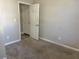 Simple bedroom with neutral walls and carpet flooring at 3690 Darrah Sw Way, Atlanta, GA 30331