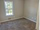 Well-lit bedroom with neutral walls and carpet flooring at 3690 Darrah Sw Way, Atlanta, GA 30331