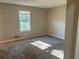 Well-lit bedroom with a large window and carpet at 3690 Darrah Sw Way, Atlanta, GA 30331