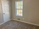 Bright bedroom with neutral walls and carpet flooring at 3690 Darrah Sw Way, Atlanta, GA 30331