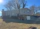 Two-story house with stone accents, attached garage, and a wooden deck at 3690 Darrah Sw Way, Atlanta, GA 30331