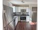 Kitchen with stainless steel appliances and white cabinets at 3690 Darrah Sw Way, Atlanta, GA 30331