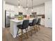 Modern kitchen boasting an island with seating and stainless steel appliances at 209 Bastian Dr # 4, Villa Rica, GA 30180