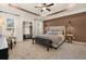 Spacious main bedroom with large bed, accent wall, and coffered ceiling at 209 Bastian Dr # 4, Villa Rica, GA 30180