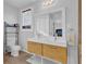 Double vanity bathroom with light wood cabinets and tile flooring at 1327 Hosea L Williams Se Dr, Atlanta, GA 30317