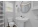 Clean bathroom with pedestal sink and shower/tub combo at 1327 Hosea L Williams Se Dr, Atlanta, GA 30317