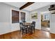 Well lit dining room with hardwood floors and a view of the kitchen at 1327 Hosea L Williams Se Dr, Atlanta, GA 30317