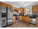 Bright kitchen with stainless steel appliances and light wood cabinets at 1327 Hosea L Williams Se Dr, Atlanta, GA 30317