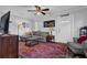 Inviting living room with a plush sofa, a decorative rug, and a Shakedown Street sign above the entry door at 1327 Hosea L Williams Se Dr, Atlanta, GA 30317