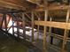 Unfinished attic with wooden beams and shelves at 1643 Westhaven Sw Dr, Atlanta, GA 30311