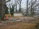 Large backyard with shed and surrounding trees at 1643 Westhaven Sw Dr, Atlanta, GA 30311