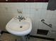 Bathroom featuring a pedestal sink with a black and white tiled floor at 1643 Westhaven Sw Dr, Atlanta, GA 30311