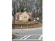 Tan and brick house with metal roof and stone wall at 1643 Westhaven Sw Dr, Atlanta, GA 30311