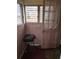 Small front porch with pink door and window at 1643 Westhaven Sw Dr, Atlanta, GA 30311