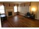 Spacious living room featuring hardwood floors and a fireplace, ready for personalization and comfortable living at 1643 Westhaven Sw Dr, Atlanta, GA 30311