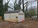 Outdoor storage shed. Great for storage and DIY potential on an inviting and lush green residential lot at 1643 Westhaven Sw Dr, Atlanta, GA 30311