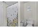 Clean bathroom with shower/tub and floral shower curtain at 6851 Roswell Rd # F35, Atlanta, GA 30328