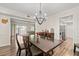 Open concept dining room with a view of the living room and kitchen at 6851 Roswell Rd # F35, Atlanta, GA 30328