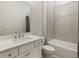 Clean bathroom with a shower/tub combo, white vanity, and tile flooring at 775 Stickley Oak Way, Woodstock, GA 30189