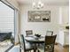 Small dining area with glass doors and chandelier at 775 Stickley Oak Way, Woodstock, GA 30189