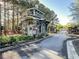 Gated community entrance with stone details and landscaping at 775 Stickley Oak Way, Woodstock, GA 30189