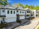 Modern townhouses with attached garages and stone accents at 775 Stickley Oak Way, Woodstock, GA 30189