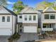 Modern two-story home with white siding and stone accents at 775 Stickley Oak Way, Woodstock, GA 30189