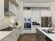 Modern kitchen with stainless steel appliances and white cabinets at 775 Stickley Oak Way, Woodstock, GA 30189