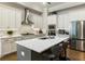 Modern kitchen with stainless steel appliances and white cabinets at 775 Stickley Oak Way, Woodstock, GA 30189