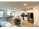 Modern kitchen with island, stainless steel appliances, and white cabinets at 2757 Malton Way, Loganville, GA 30052