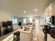 Open concept kitchen with island, stainless steel appliances, and white cabinets at 2757 Malton Way, Loganville, GA 30052