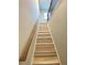 Bright, open staircase with wooden handrail leading to the upper level at 2757 Malton Way, Loganville, GA 30052