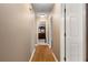 Long hallway with wood floors connecting bedrooms and bathroom at 51 Willow Bend Nw Dr, Cartersville, GA 30121