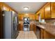 Kitchen features stainless steel appliances and wood cabinets at 51 Willow Bend Nw Dr, Cartersville, GA 30121