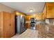 Galley kitchen with stainless steel appliances and granite counters at 51 Willow Bend Nw Dr, Cartersville, GA 30121