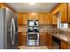 Kitchen with stainless steel appliances and wood cabinets at 51 Willow Bend Nw Dr, Cartersville, GA 30121