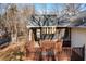 Deck and screened porch overlooking wooded backyard at 51 Willow Bend Nw Dr, Cartersville, GA 30121