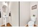 Small bathroom with pedestal sink, toilet and simple decor at 5531 Pine Aly, Lithonia, GA 30058