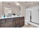 Double vanity bathroom with a shower and tile flooring at 5531 Pine Aly, Lithonia, GA 30058